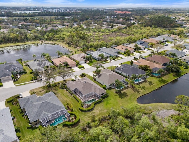 bird's eye view featuring a residential view and a water view