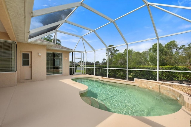 outdoor pool featuring a lanai and a patio area