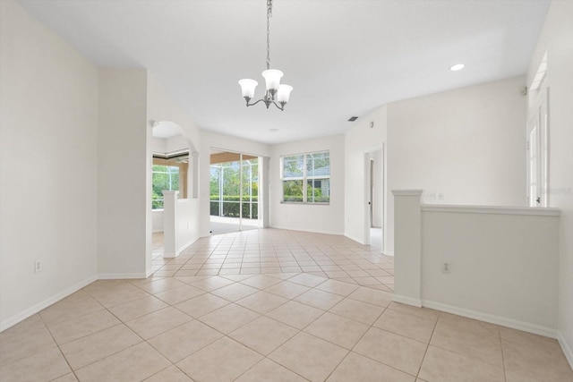 spare room featuring recessed lighting, baseboards, a chandelier, and light tile patterned flooring