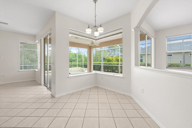 unfurnished dining area with baseboards, a chandelier, and light tile patterned flooring