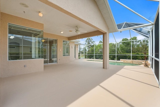 view of patio with ceiling fan, a lanai, and an outdoor pool