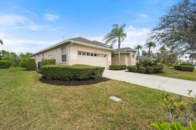 view of front of house featuring concrete driveway, an attached garage, a front lawn, and stucco siding