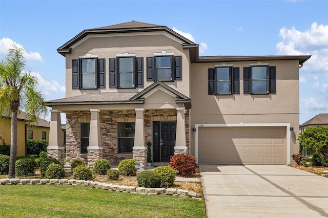 view of front facade with concrete driveway, a garage, stone siding, and stucco siding