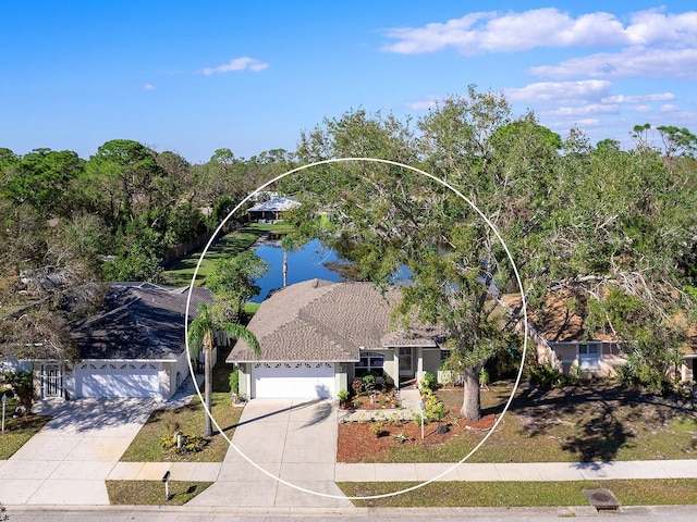 birds eye view of property with a water view