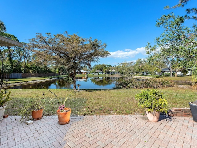 view of patio with a water view