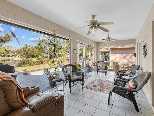 sunroom / solarium with ceiling fan