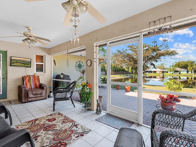 sunroom featuring a ceiling fan