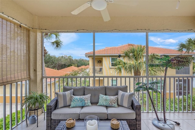 sunroom with a healthy amount of sunlight and a ceiling fan