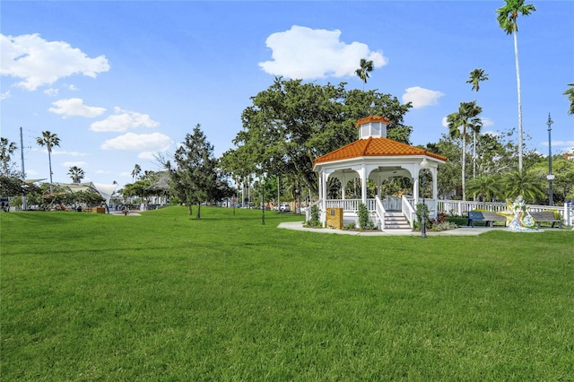 surrounding community featuring a gazebo and a lawn