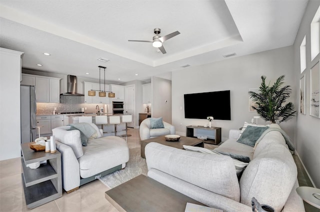 6027 White Mangrove Ln, Bradenton, FL 34210 - living room with recessed lighting, a tray ceiling, visible vents, and a ceiling fan