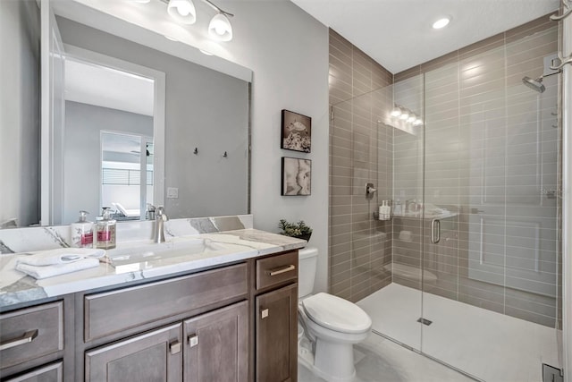 6027 White Mangrove Ln, Bradenton, FL 34210 - full bathroom featuring vanity, a shower stall, and toilet