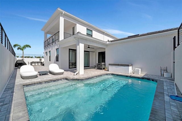 6027 White Mangrove Ln, Bradenton, FL 34210 - rear view of house with stucco siding, a ceiling fan, a patio, fence, and a balcony