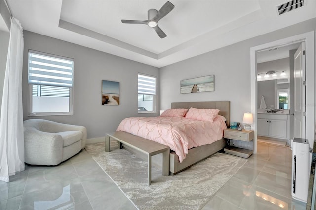 6027 White Mangrove Ln, Bradenton, FL 34210 - tiled bedroom featuring a raised ceiling, a ceiling fan, visible vents, and baseboards