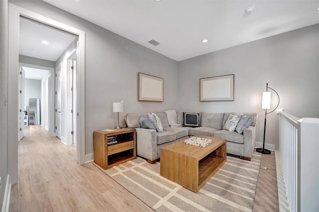 6027 White Mangrove Ln, Bradenton, FL 34210 - living room featuring recessed lighting, visible vents, baseboards, and light wood-style flooring