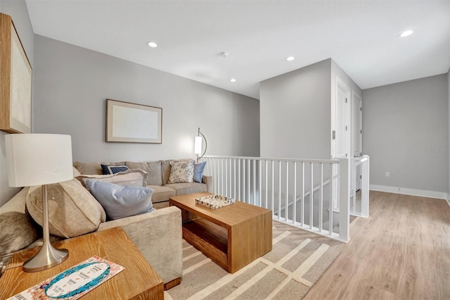 6027 White Mangrove Ln, Bradenton, FL 34210 - living room with light wood-style flooring, recessed lighting, and baseboards