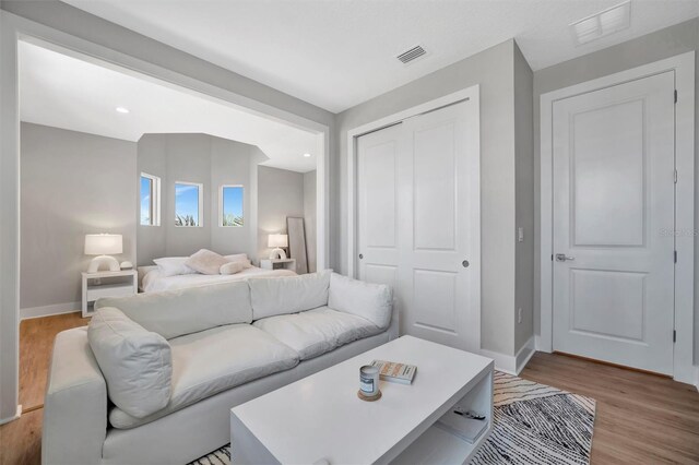 6027 White Mangrove Ln, Bradenton, FL 34210 - bedroom featuring wood finished floors, visible vents, a closet, and baseboards