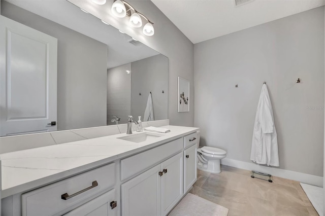 6027 White Mangrove Ln, Bradenton, FL 34210 - full bathroom featuring visible vents, toilet, vanity, and baseboards