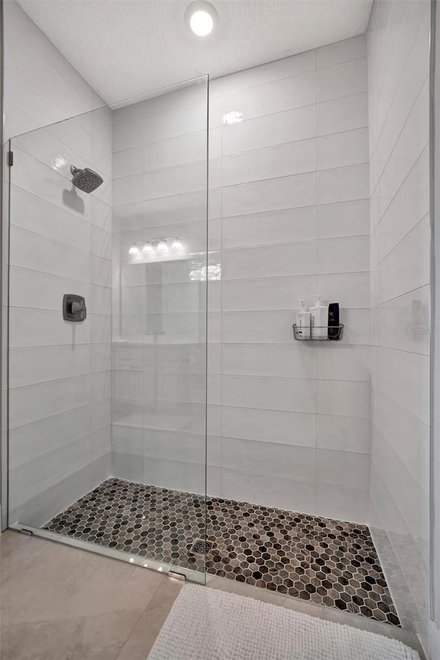 6027 White Mangrove Ln, Bradenton, FL 34210 - bathroom with a shower stall and a textured ceiling
