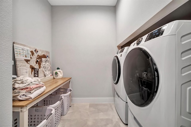 6027 White Mangrove Ln, Bradenton, FL 34210 - laundry area featuring baseboards, washing machine and dryer, and laundry area