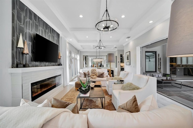 living area featuring recessed lighting, a chandelier, and a tile fireplace