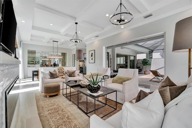 living room with visible vents, beamed ceiling, coffered ceiling, and an inviting chandelier