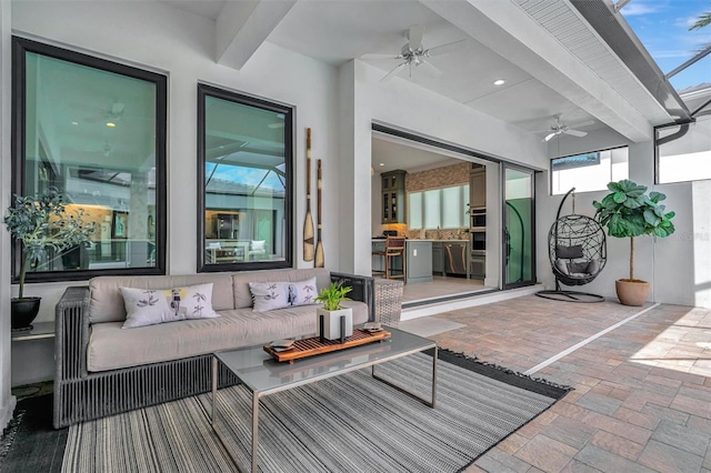 view of patio with outdoor lounge area and ceiling fan