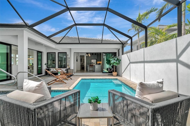 outdoor pool with a patio area