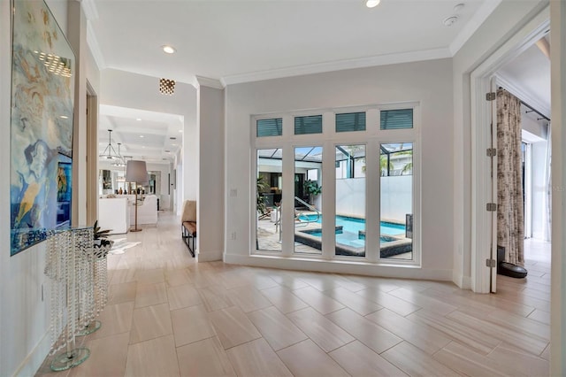 doorway to outside with crown molding, recessed lighting, and baseboards