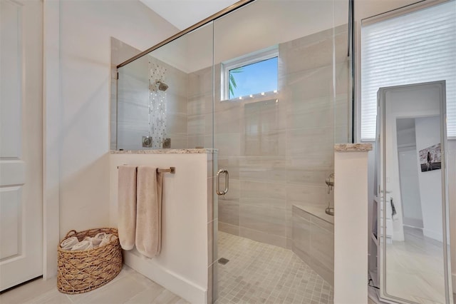 bathroom featuring a shower stall