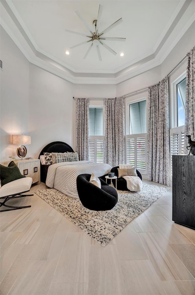 bedroom with recessed lighting, a tray ceiling, ornamental molding, and a ceiling fan