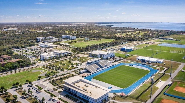 birds eye view of property with a water view