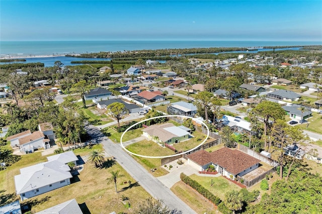 birds eye view of property featuring a residential view and a water view