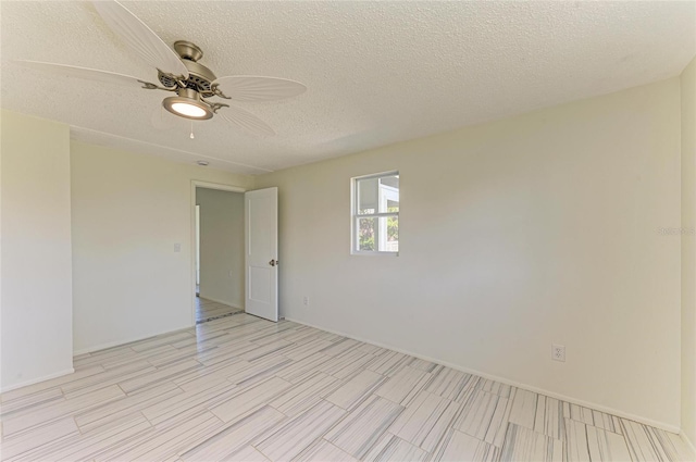 unfurnished room with a textured ceiling and ceiling fan