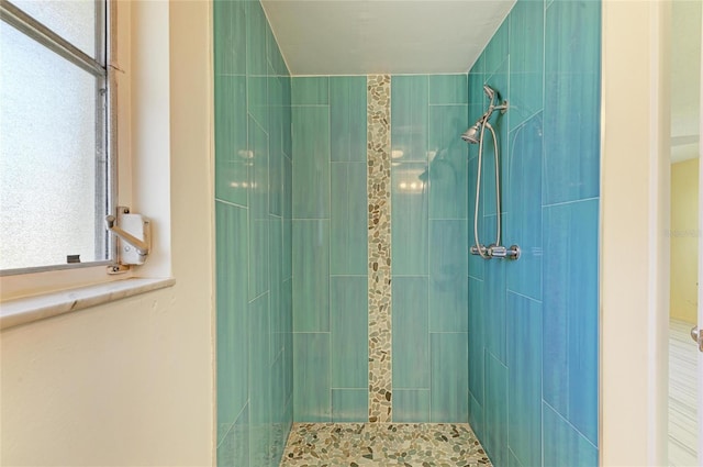 full bath with tiled shower