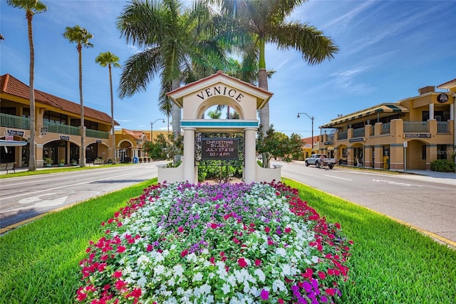 community / neighborhood sign featuring a residential view