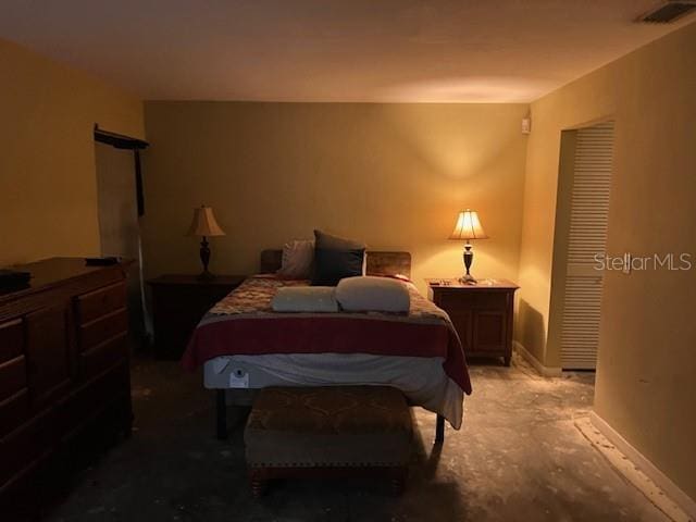 bedroom featuring visible vents and baseboards