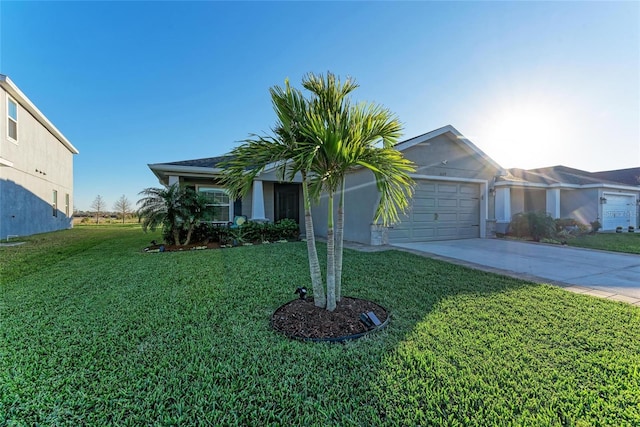 view of front facade with an attached garage, concrete driveway, and a front yard