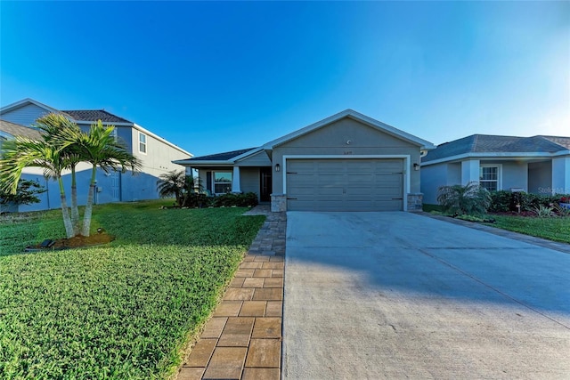 ranch-style home featuring concrete driveway, a front lawn, and an attached garage