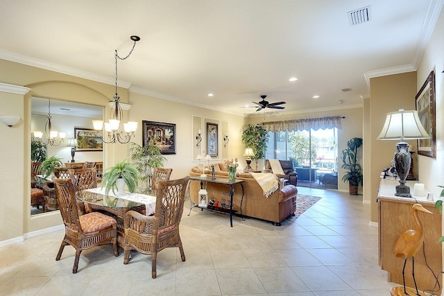 dining space featuring light tile patterned floors, visible vents, ceiling fan with notable chandelier, and ornamental molding