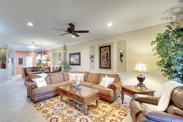 living area with light tile patterned flooring, recessed lighting, ornate columns, and ornamental molding