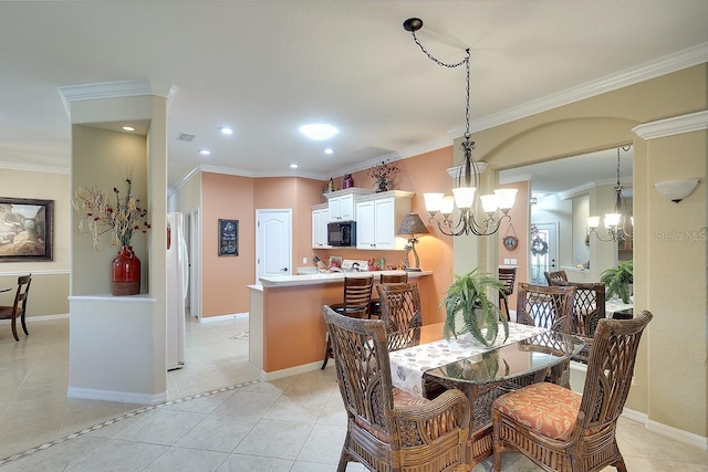 dining space with light tile patterned floors, a notable chandelier, crown molding, and baseboards