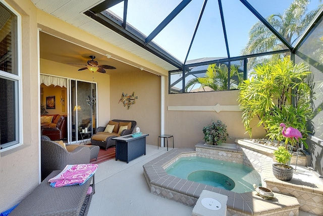 view of pool featuring a patio, an in ground hot tub, a lanai, and ceiling fan