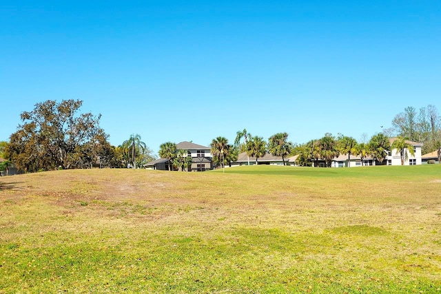 view of property's community with a lawn