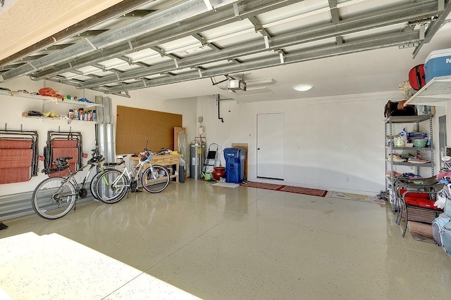 garage with a garage door opener and electric water heater