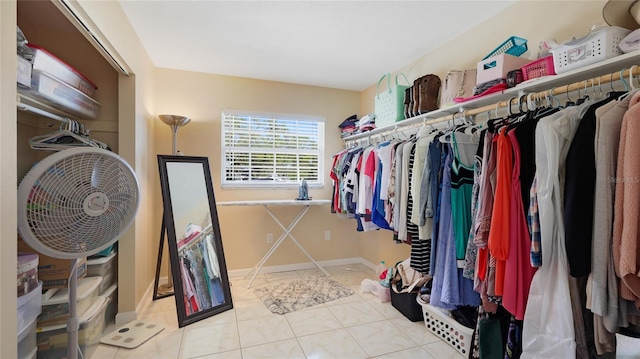 walk in closet with tile patterned floors