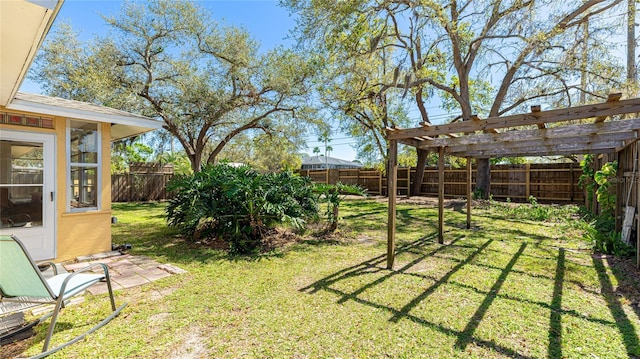 view of yard with a fenced backyard and a pergola