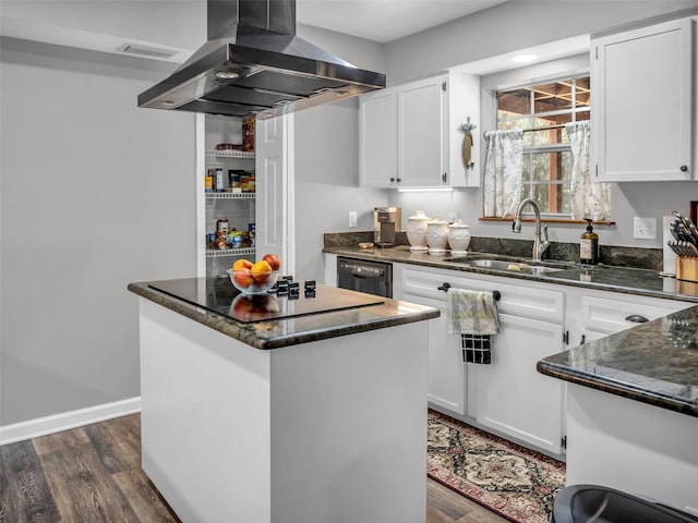 kitchen featuring dark wood-style flooring, a sink, a center island, dark stone countertops, and island exhaust hood