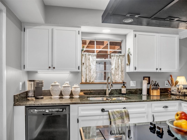 kitchen featuring white cabinets, dishwashing machine, dark stone countertops, under cabinet range hood, and a sink