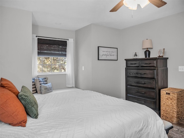 bedroom featuring wood finished floors and a ceiling fan