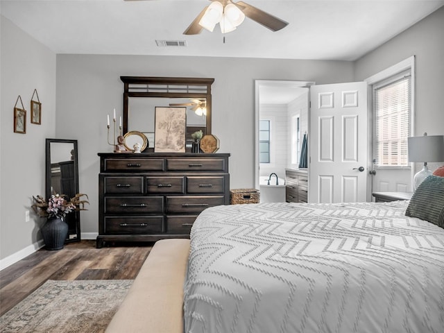 bedroom with a ceiling fan, dark wood finished floors, visible vents, and baseboards